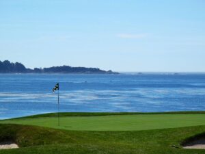 golf course near body of water